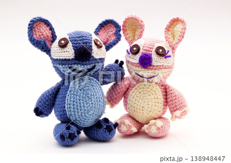 Knitted wool aliens on a white background 138948447