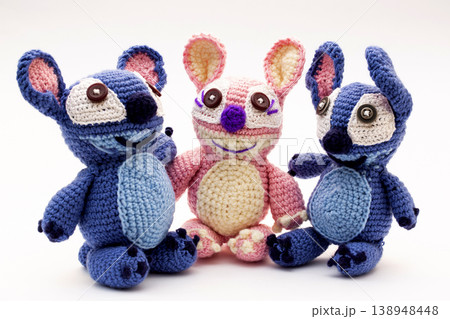 Knitted wool aliens on a white background 138948448