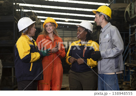 Group of mix multiracial race engineer working together at factory car part warehouse. Group of mix multiracial race engineer working together at factory car part warehouse. 138948555