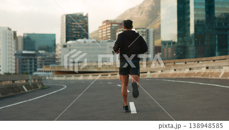Sports, back and running in morning on city, street and bridge for fitness, workout and marathon training. Athlete, man or exercise on South Africa road for wellness, health or triathlon performance Sports, back and running in morning on city, street and bridge for fitness, workout and marathon training. Athlete, man or exercise on South Africa road for wellness, health or triathlon performance 138948585
