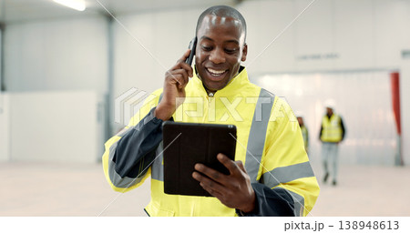 Happy black man, engineer and phone call with tablet for communication, networking or discussion at warehouse. African male person, architect or contractor smile on mobile smartphone for conversation 138948613