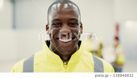 Smile, happy and portrait of black man construction worker standing with confidence in a warehouse. Positive, pride and young African industrial employee at an indoor site for maintenance or repairs. 138948832