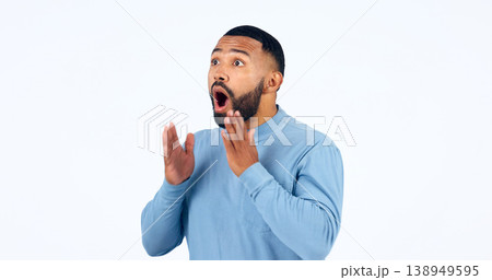 News, announcement and man with surprise on face in studio, white background or mockup space. Wow, emoji and excited or shocked person with secret, drama or hearing crazy information on promotion 138949595