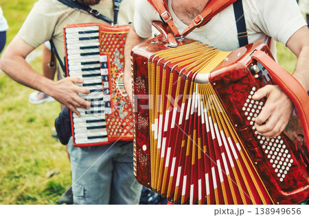 Folk Musicians Playing Accordions Together Outdoors Folk Musicians Playing Accordions Together Outdoors 138949656