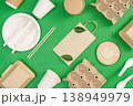 Eco friendly packaging materials on green background 138949979