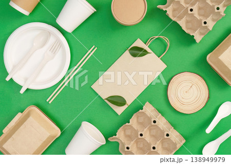 Eco friendly packaging materials on green background Eco friendly packaging materials on green background 138949979