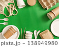 Sustainable packaging and utensils on green background 138949980