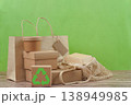 Recyclable packaging and reusable bag on green background 138949985