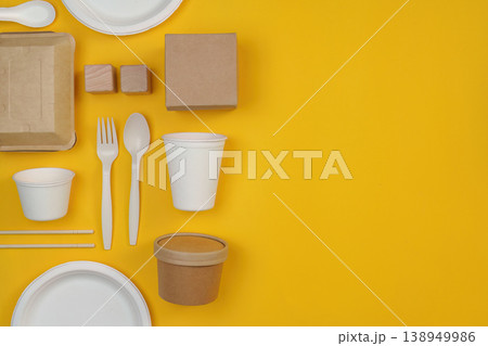 Sustainable tableware set on yellow background 138949986