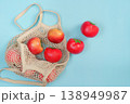 Sustainable shopping with reusable bag and fresh tomatoes 138949987