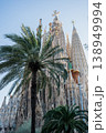 Sagrada Familia basilica with palm trees and blue sky in Barcelona Spain 138949994
