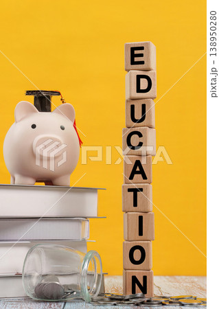 Education savings concept with piggy bank and books Education savings concept with piggy bank and books 138950280