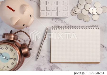 Financial planning tools with piggy bank and notebook Financial planning tools with piggy bank and notebook 138950281
