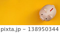 Piggy bank on a vibrant yellow background 138950344