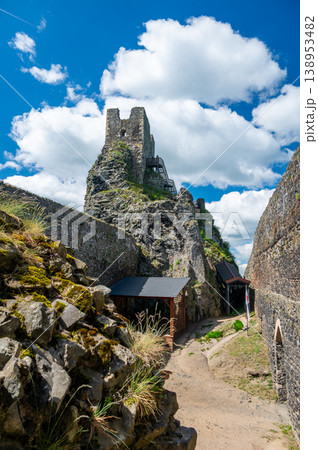 Close up view of the walls and iconic towers of Trosky Castle in Cesky Raj Czech Republic with massive stone structures rising above ruins in summer weather popular tourist destination Close up view of the walls and iconic towers of Trosky Castle in Cesky Raj Czech Republic with massive stone structures rising above ruins in summer weather popular tourist destination 138953482