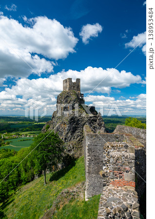Close up view of the walls and iconic towers of Trosky Castle in Cesky Raj Czech Republic with massive stone structures rising above ruins in summer weather popular tourist destination 138953484