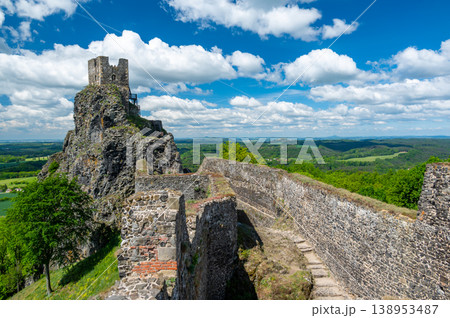 Close up view of the walls and iconic towers of Trosky Castle in Cesky Raj Czech Republic with massive stone structures rising above ruins in summer weather popular tourist destination Close up view of the walls and iconic towers of Trosky Castle in Cesky Raj Czech Republic with massive stone structures rising above ruins in summer weather popular tourist destination 138953487