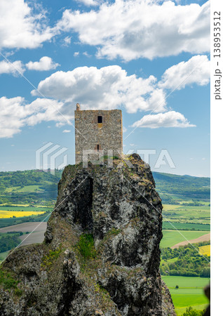 Close up view of the walls and iconic towers of Trosky Castle in Cesky Raj Czech Republic with massive stone structures rising above ruins in summer weather popular tourist destination 138953512