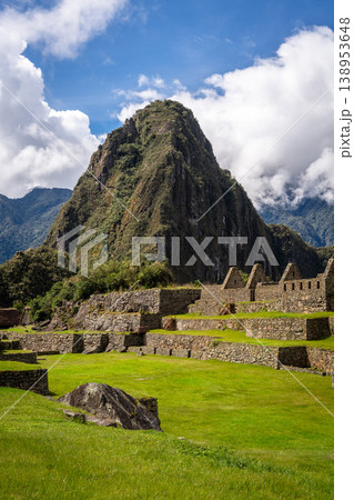 Panoramic view of Machu Picchu ruins with Huayna Picchu in background, Peru Panoramic view of Machu Picchu ruins with Huayna Picchu in background, Peru 138953648