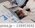 Collaborative data analysis with laptops and charts in an office 138953692