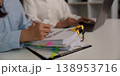 Team reviewing financial documents and reports in office 138953716