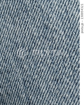 Denim texture closeup showing detailed weave pattern, ideal for background or fashion concepts Denim texture closeup showing detailed weave pattern, ideal for background or fashion concepts 138954321