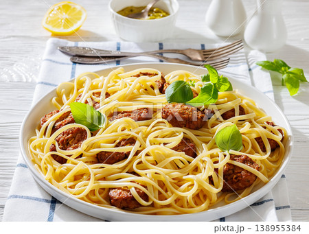 Pasta linguine with meatballs, pesto sauce, lemon 138955384