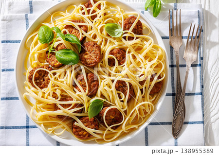 Pasta linguine with meatballs, pesto sauce, lemon 138955389