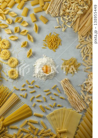 Assorted dry pasta types with flour and egg yolk Assorted dry pasta types with flour and egg yolk 138955449