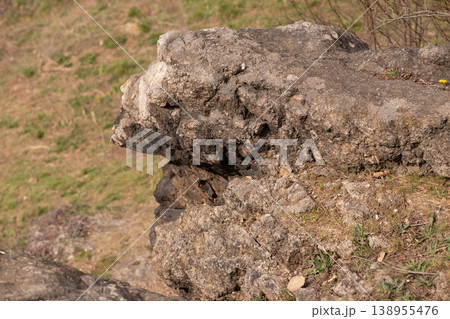 Close up of rugged grey stone textures and natural rock formations in outdoor landscape Close up of rugged grey stone textures and natural rock formations in outdoor landscape 138955476