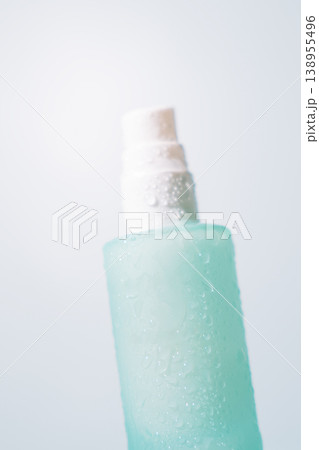 Close up of frosted cosmetic pump bottle in soft natural light Close up of frosted cosmetic pump bottle in soft natural light 138955496