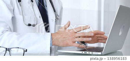Doctor discussing medical information during an online consultation via teleconference, providing remote healthcare service. Medicine, healthcare and science concept Doctor discussing medical information during an online consultation via teleconference, providing remote healthcare service. Medicine, healthcare and science concept 138956183