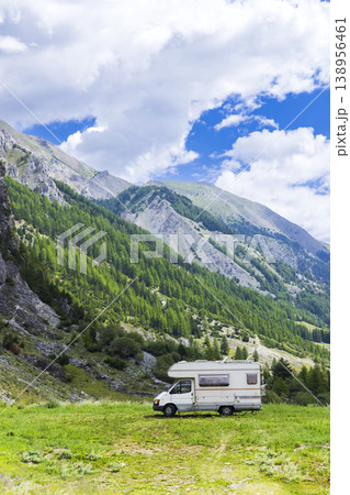 Camper van exploring mountain landscape in Italian Alps 138956461