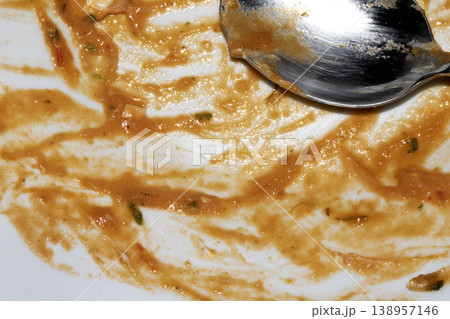 Close up of left over soup in a dirty plate bowl waiting to be washed up 138957146