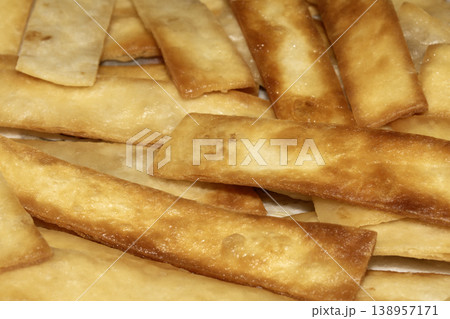 Home made fried tortilla bread slices to dip into soup 138957171