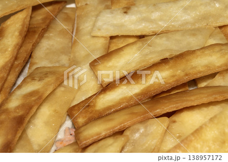 Home made fried tortilla bread slices to dip into soup Home made fried tortilla bread slices to dip into soup 138957172