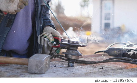 Artisans Create Sparks. Metalwork By Diligent Craftspeople. Focused Artisans Shape Metal With Precision. Bright Sparks Fly As Skilled Craftsmen Meticulously Work On Metal Objects Artisans Create Sparks. Metalwork By Diligent Craftspeople. Focused Artisans Shape Metal With Precision. Bright Sparks Fly As Skilled Craftsmen Meticulously Work On Metal Objects 138957676