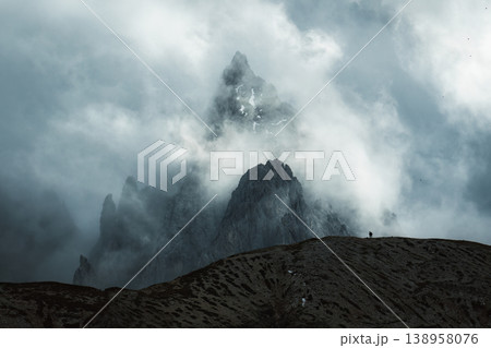 Moody rugged mountain peak with misty in Tre Cime, Dolomites 138958076