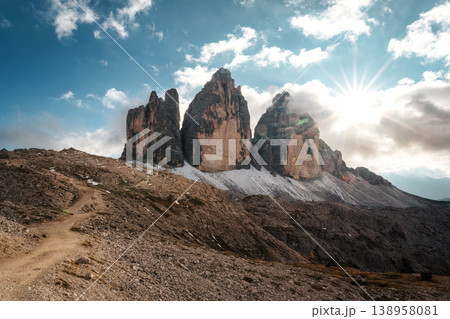 Tre Cime mountain peak and hiking trail under sunlight in Dolomites, Italy 138958081