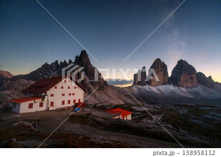 Scenic view of Milky Way over Tre Cime di Lavaredo mountain and Rifugio Locatelli at night in Dolomites, Italy Scenic view of Milky Way over Tre Cime di Lavaredo mountain and Rifugio Locatelli at night in Dolomites, Italy 138958112