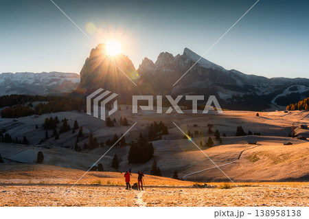 Autumn morning at Seiser Alm with sunrise over Dolomites mountain and rolling hill in Italy 138958138