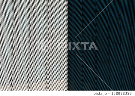 Modern perforated metal mesh texture surface with high contrast composition 138958359