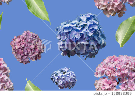 A seamless pattern filled with clusters of flowers in shades of pink and blue along with green leaves on a blue background. It can be used for crafts and textiles A seamless pattern filled with clusters of flowers in shades of pink and blue along with green leaves on a blue background. It can be used for crafts and textiles 138958399