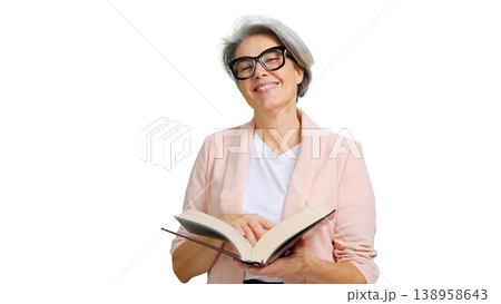Smiling mature woman reading book wearing glasses 138958643