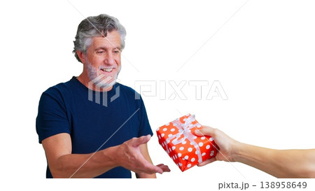 Happy senior man receiving present from unknown person Happy senior man receiving present from unknown person 138958649
