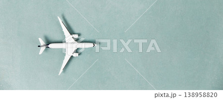 Minimalist Flat Lay with Airplane Model on Blue Background Minimalist Flat Lay with Airplane Model on Blue Background 138958820