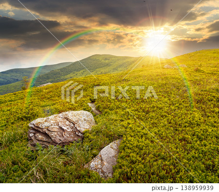 mountain landscape during summer at sunset. alpine meadows on green slopes and hills in evening light. amazing adventure scenery under rainbow. exploration of remote highland location for inspiration mountain landscape during summer at sunset. alpine meadows on green slopes and hills in evening light. amazing adventure scenery under rainbow. exploration of remote highland location for inspiration 138959939