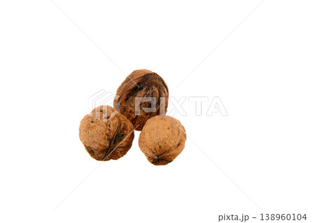 Three Whole Walnuts in Shell on White Background Close-Up Showing Natural Texture and Food Concept Three Whole Walnuts in Shell on White Background Close-Up Showing Natural Texture and Food Concept 138960104