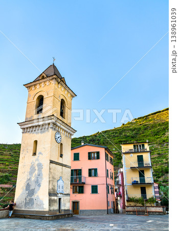 Bell tower of San Lorenzo Church in Manarola at the Cinque Terre in Italy Bell tower of San Lorenzo Church in Manarola at the Cinque Terre in Italy 138961039
