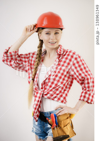 Girl using some power tools for work at home 138961349